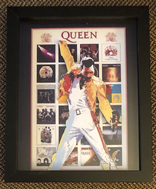 Freddie Mercury with a background of Queen Album covers, 8 x 10, $25