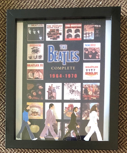 The Beatles passing by their albums from 64-70, $25